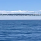 A small plane flies underneath the Mackinac Bridge On July 28, 2020